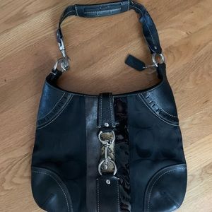 Black Coach shoulder bag with large buckle detail